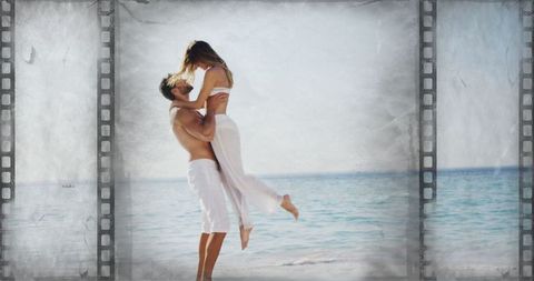 Romantic Couple Embracing by Seaside with Vintage Film Effect
