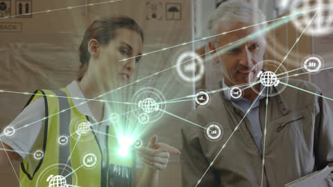 Warehouse Workers Collaborating Over Digital Network Interface Technology