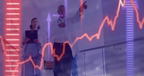 Medical team walking corridor with dynamic health data visualization and analytics overlay