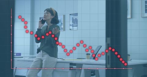 Businesswoman Analyzing Financial Data Charts in Office Space