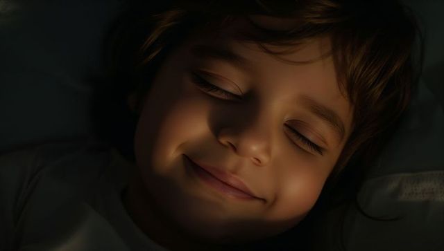 Sleeping child smiling in warm bedside glow closeup serene nighttime portrait