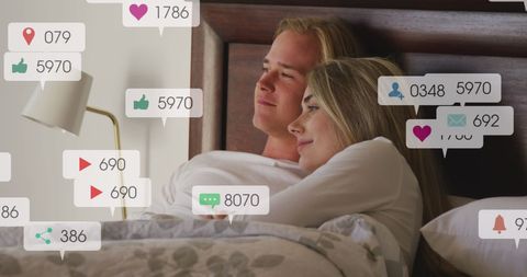 Couple Relaxing in Bed with Social Media Notification Overlays