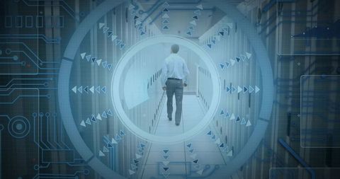 IT Technician Walking Down Data Center Corridor Through Futuristic HUD Overlay