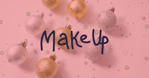 Festive Ornaments with MakeUp Text on Pink Background
