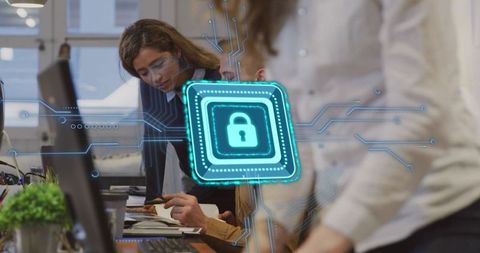 Team Collaborating on Cybersecurity Solutions in Modern Open Office with Digital Lock