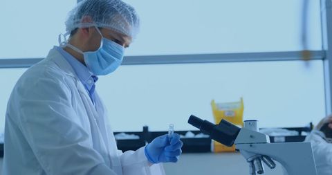Scientist Conducting Research with Microscope in Lab - Download Free Stock Images Pikwizard.com