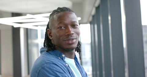 Smiling professional in modern office environment