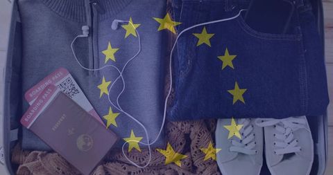 Packing european trip carry-on: passport, boarding passes, jeans, sneakers, earphones