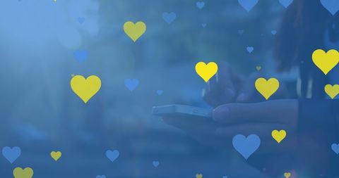 Asian Adult Using Smartphone Surrounded by Digital Hearts