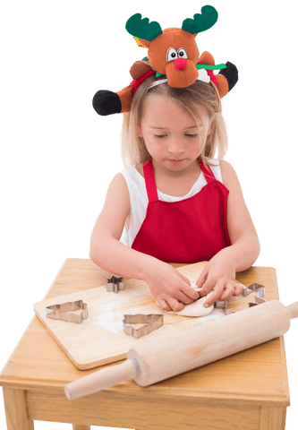 girl with reindeer antlers making holiday cookies, transparent png - Download Free Stock Videos Pikwizard.com