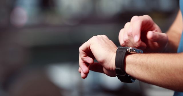 Close-up of person's hands operating smartwatch - Download Free Stock Images Pikwizard.com