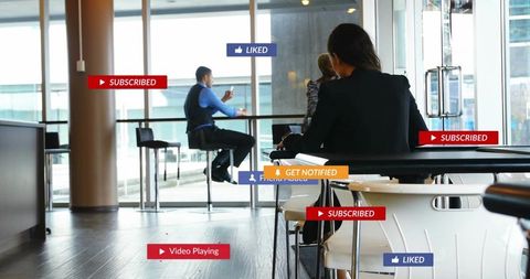 Professionals networking in modern coworking lounge with social media engagement overlays
