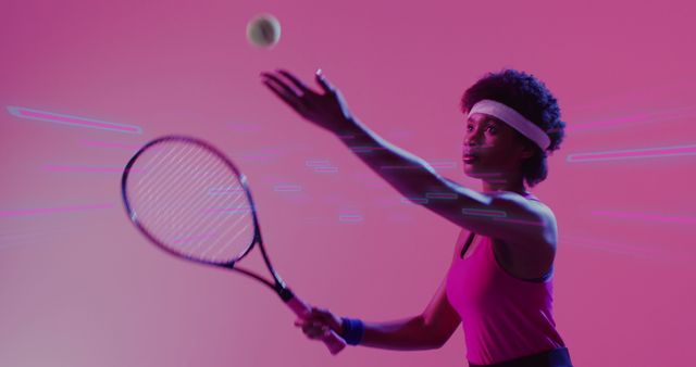 Female tennis player with afro hair in pink tank top about to serve with racquet against vibrant, futuristic background. Ideal for promoting active lifestyles, sports apparel, inclusivity in athletics, sports events, and fitness concepts.