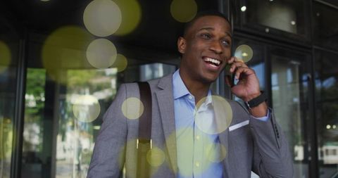 Bright Urban Businessman Communicating on Smartphone