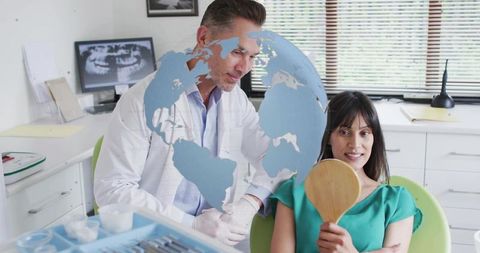Dentist Helping Female Patient During Dental Examination