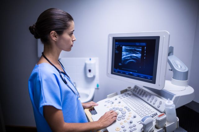 Nurse Examining Ultrasonic Monitor in Hospital - Download Free Stock Photos Pikwizard.com
