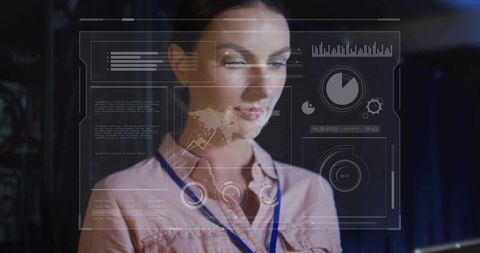Businesswoman analyzing futuristic holographic interface