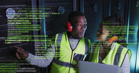 african american engineers managing server room with data green coding overlays - Download Free Stock Images Pikwizard.com