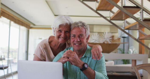 Happy Senior Couple Using Laptop in Modern Home Living Room - Download Free Stock Images Pikwizard.com