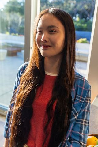 Asian woman enjoying relaxed sunday morning at home