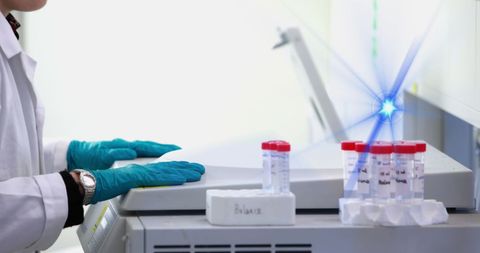 Scientist analyzing samples in high-tech laboratory