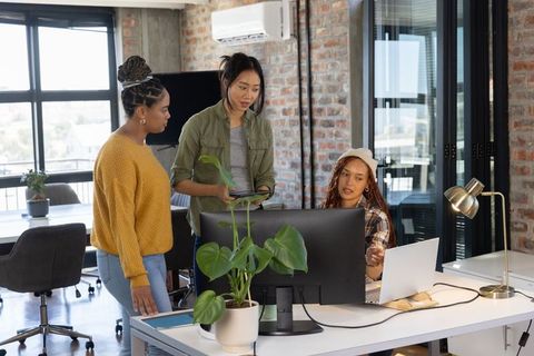Diverse Female Team Collaborating in Modern Office Interior