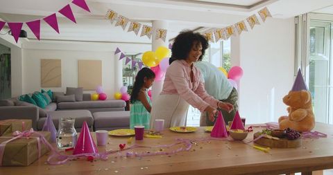 Diverse Family Prepares Colorful Birthday Celebration At Home