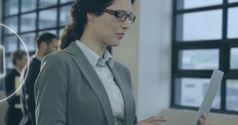 Focused Businesswoman Reading Document in Modern Office - Download Free Stock Images Pikwizard.com