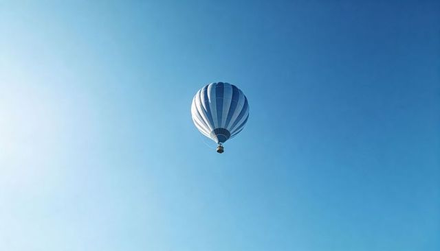 Blue Striped Hot Air Balloon Floating Over Clear Sky for Travel and Minimalist Design