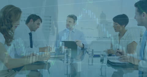 Business Team Meeting with Abstract Financial Charts Overlay