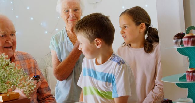 Grandparents Celebrating Birthday with Happy Grandchildren at Home - Download Free Stock Images Pikwizard.com