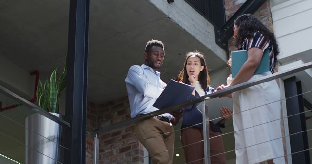 Diverse Business Team Discussing New Project on Office Balcony - Download Free Stock Images Pikwizard.com