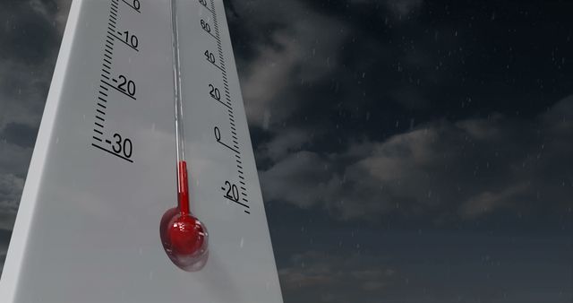 This close-up of a thermometer displaying sub-zero temperatures against a stormy sky with clouds can be used for weather-related content, blogs, educational materials, presentations on climate change, and illustrating cold winter conditions in advertisements and websites.