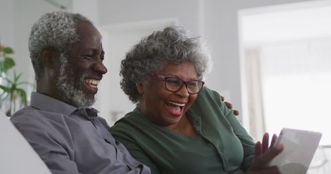 Senior African American Couple Making Video Call at Home