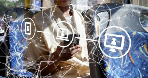 Woman using smartphone on bus connecting to digital network overlay and cloud icons