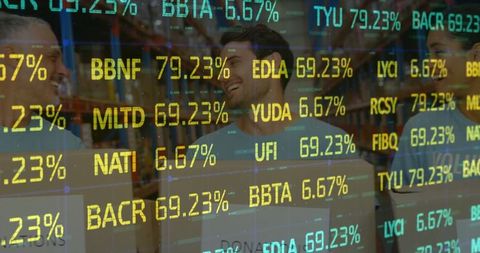 Volunteers with donation boxes behind stock market display