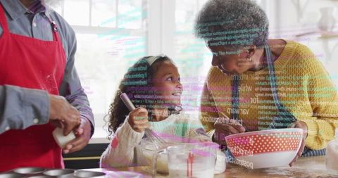 Grandparents and Granddaughter Baking Together, Mixing Batter and Learning Basic Coding