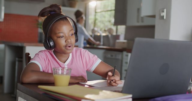 Child Wearing Headphones Studying Online at Home - Download Free Stock Images Pikwizard.com