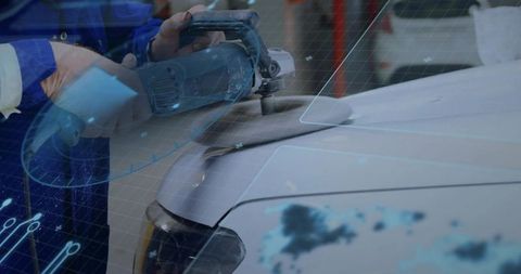 Mechanic polishing car fender with rotary tool and ar overlay for high-tech bodywork workshop