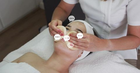 Esthetician applying cotton pads during facial treatment in spa closeup, serene skincare
