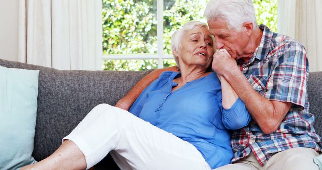 Senior Couple Embracing and Comforting Each Other on Couch - Download Free Stock Images Pikwizard.com