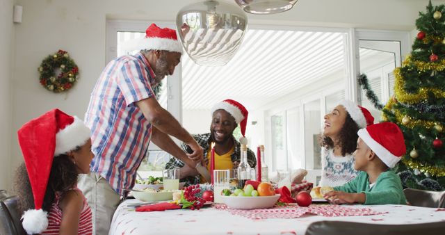 Family Celebrating Christmas Dinner at Home with Festive Decorations - Download Free Stock Images Pikwizard.com