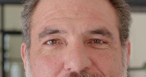 Senior gentleman displaying thoughtful expression looking forward