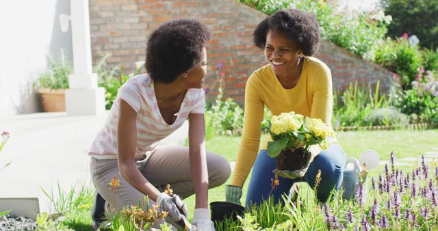 Mother and Daughter Bonding While Gardening Outdoors - Download Free Stock Images Pikwizard.com