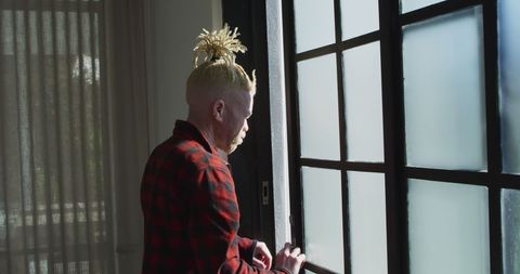 Albinism African American Man Relaxing by Window at Home - Download Free Stock Images Pikwizard.com