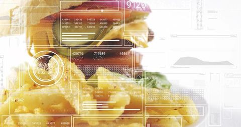 Stacked cheeseburger with melted cheese and lettuce with futuristic hud and digital data overlays