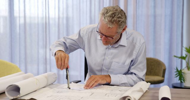 Architect Working on Blueprints with Precision Instruments - Download Free Stock Images Pikwizard.com