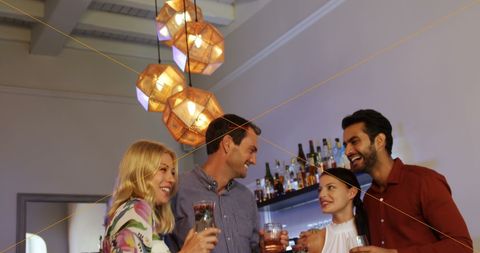 Group of Diverse Friends Enjoying Social Gathering at Bar