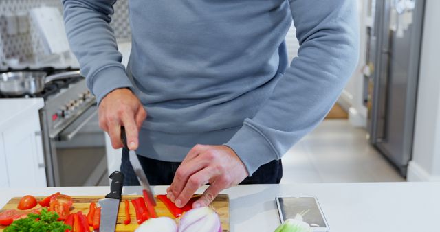 Man Cooking in Modern Kitchen Chopping Vegetables - Download Free Stock Images Pikwizard.com