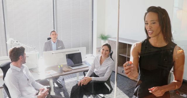 Business Team in Meeting Room Brainstorming Ideas on Transparent Board - Download Free Stock Images Pikwizard.com